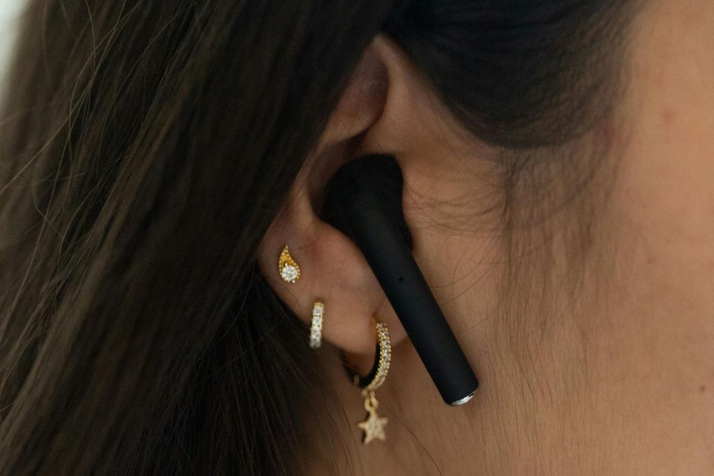 wellness tech - a woman with earbuds - mindfulness