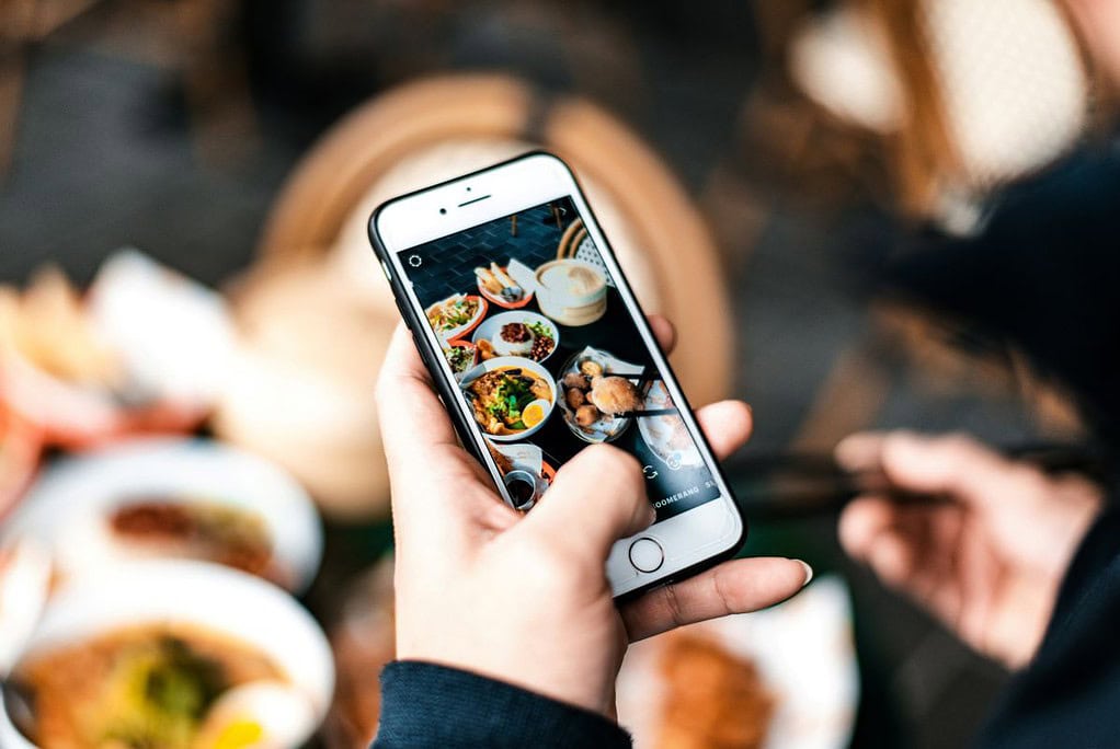 wellness apps - nutrition - mobile phone taking a photo of food
